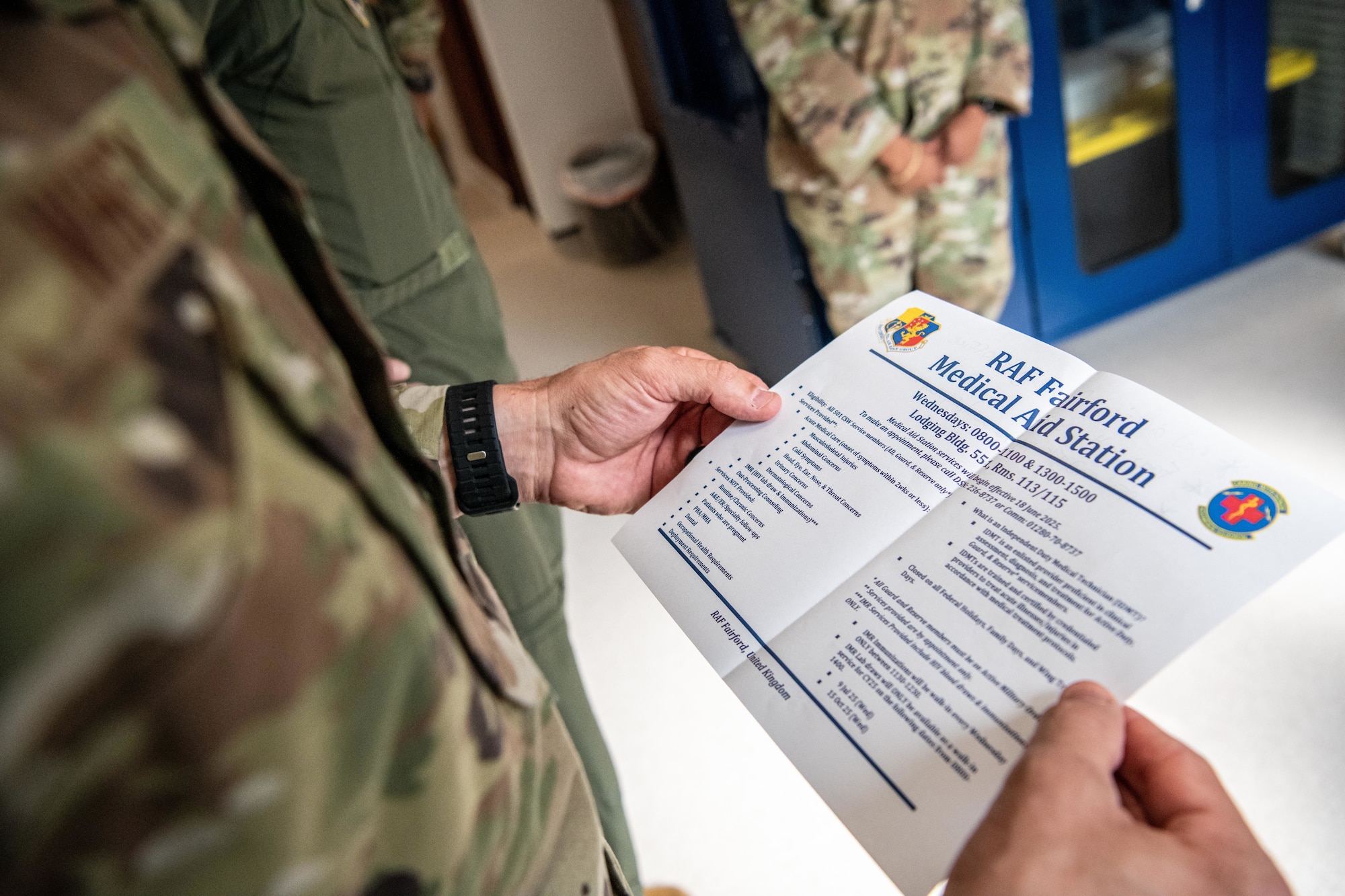 A Pathfinder reviews an informational flyer for the new medical aid station at RAF Fairford