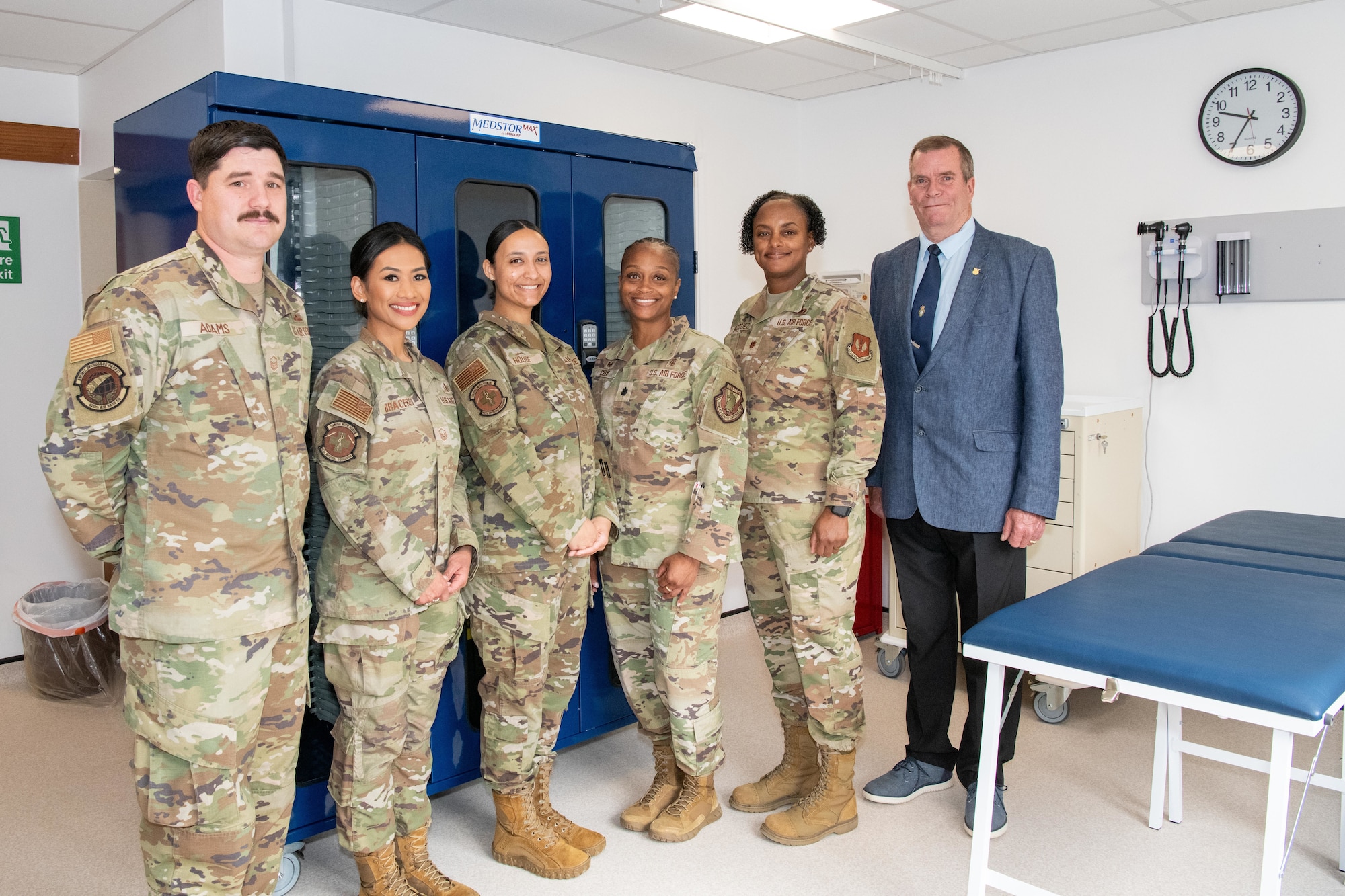 Members of the 422nd Medical Squadron and 420th Air Base Squadron pose for a photo inside the new medical aid station