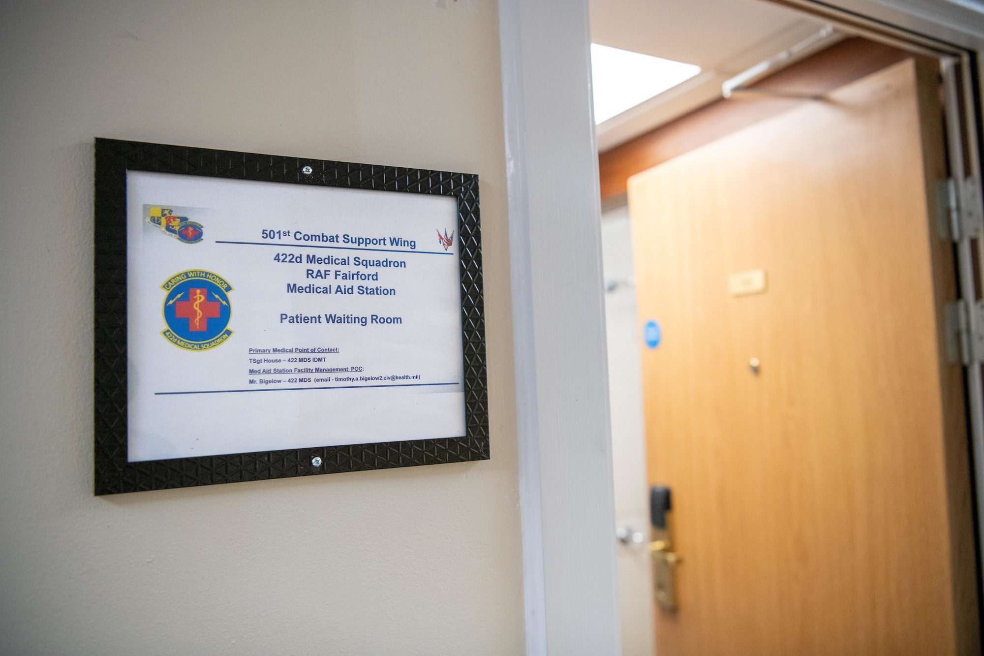 A sign marks the patient waiting room inside the new medical aid station at RAF Fairford