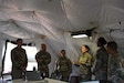 Col. Courtney Sugai provides operational guidance to the brigade staff inside the 402nd Army Field Support Brigade Tactical Operations Center during Exercise Talisman Sabre 25.
