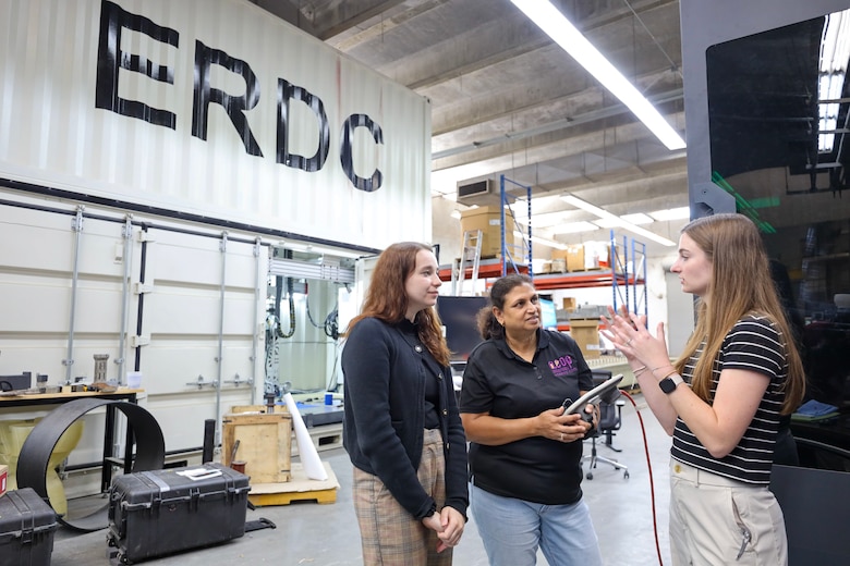 Employees at ERDC give a tour to a visiting teacher through the RESET program