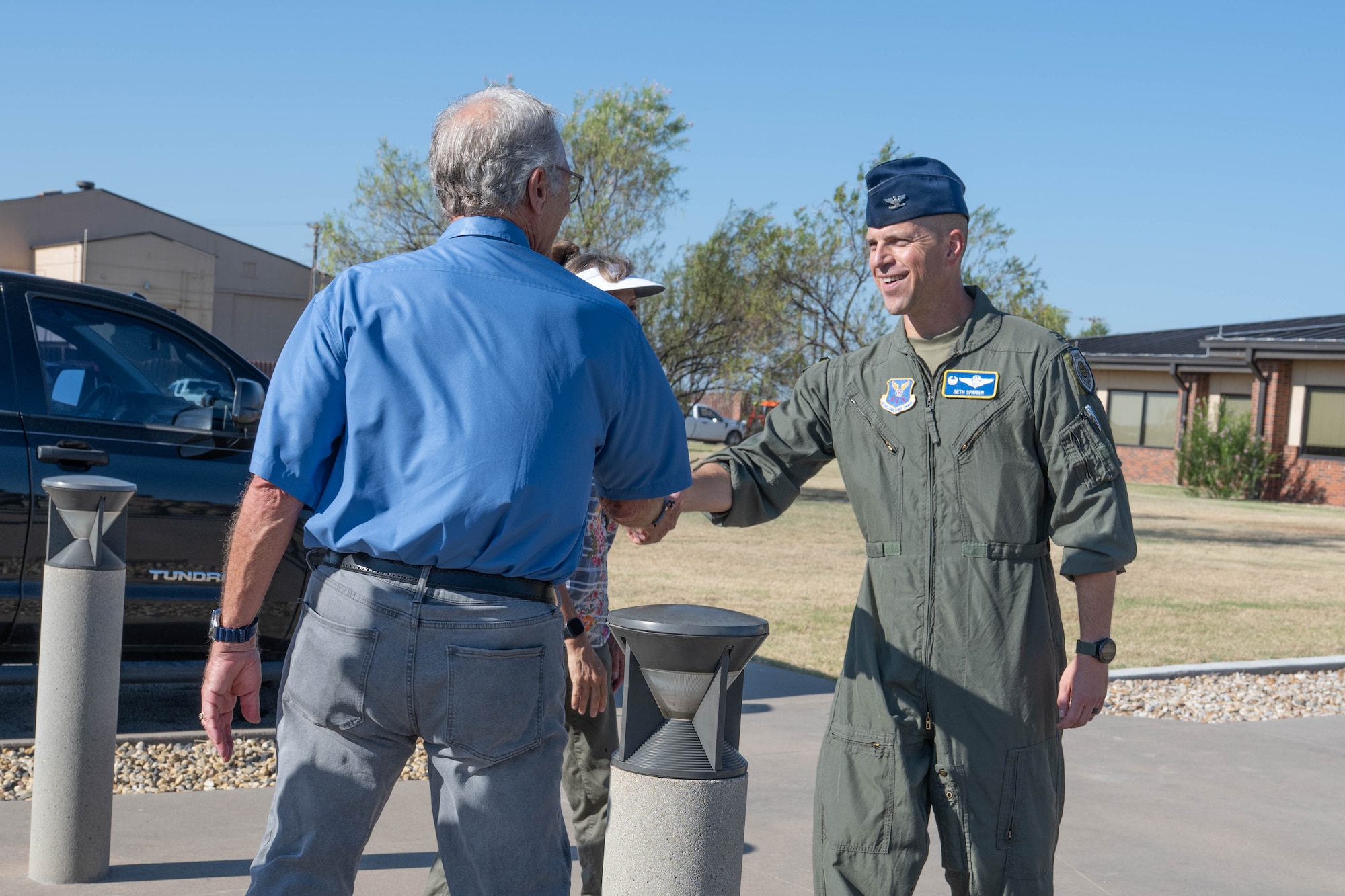 U.S. Air Force Col. Seth Spanier, 7th Bomb Wing commander, greets Mr. Randy Burchell, 7th Equipment Maintenance Squadron honorary commander, during a tour at Dyess Air Force Base, Texas, Aug. 6, 2025. The Dyess Honorary Commander program introduces civic leaders to the Dyess mission, the U.S. Air Force, and the U.S. Department of Defense. (U.S. Air Force photo by Airman Caleb Schellenberg)