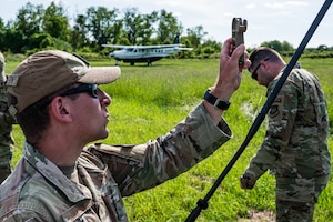 Airman checks wind speed