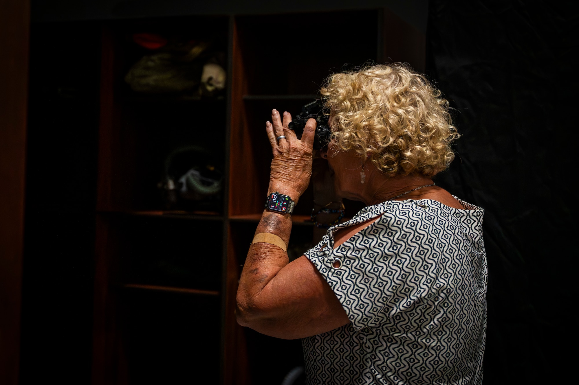 Mrs. Janelle O’Connell, 7th Health Care Operations Squadron honorary commander, looks through night vision goggles during a tour at Dyess Air Force Base, Texas, Aug. 6, 2025. The Dyess Honorary Commander program enhances civilian understanding of Dyess AFB and promotes collaboration with local leaders. (U.S. Air Force photo by Staff Sgt. Leon Redfern)