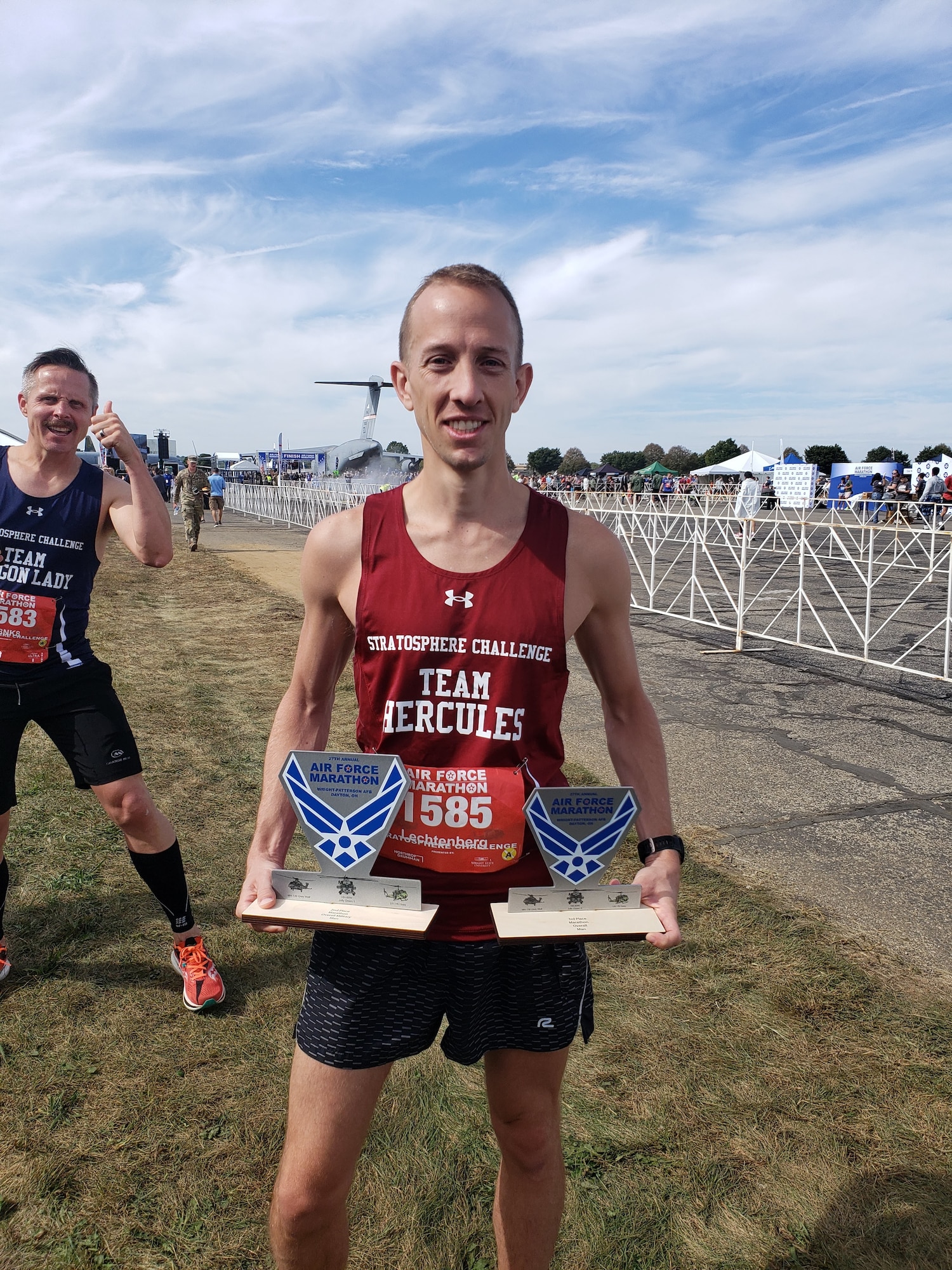 Maj. Brett Lechtenberg, 377th Comptroller Squadron director of operations, holds two trophies after completing the 27th Annual Air Force Marathon at Wright-Patterson Air Force Base, Ohio, Sept. 16, 2023. Lechtenberg placed second overall among military runners and third in the men’s division. The Air Force Marathon attracts thousands of participants from around the world and highlights Air Force heritage and resilience. (Courtesy Photo)