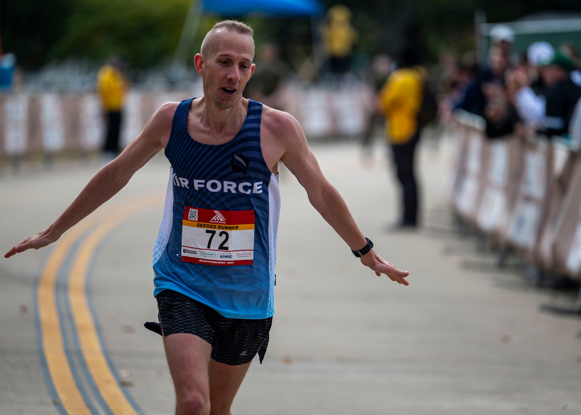 Capt. Brett Lechtenberg, from Roy, Utah, celebrates while crossing the finish line during the 2024 Armed Forces Marathon Championships. The 2024 Armed Forces Marathon Championships held in conjunction with the 49th Marine Corps Marathon on Sunday, October 27th. Service members from the Army, Marine Corps, Navy (with Coast Guard runners, and Air Force (with Space Force runners) go for gold.  Visit www.ArmedForcesSports.defense.gov to learn more about the Armed Forces Sports program and the other sports offered. (Department of Defense photo by MC2 Colby Mothershead – released).