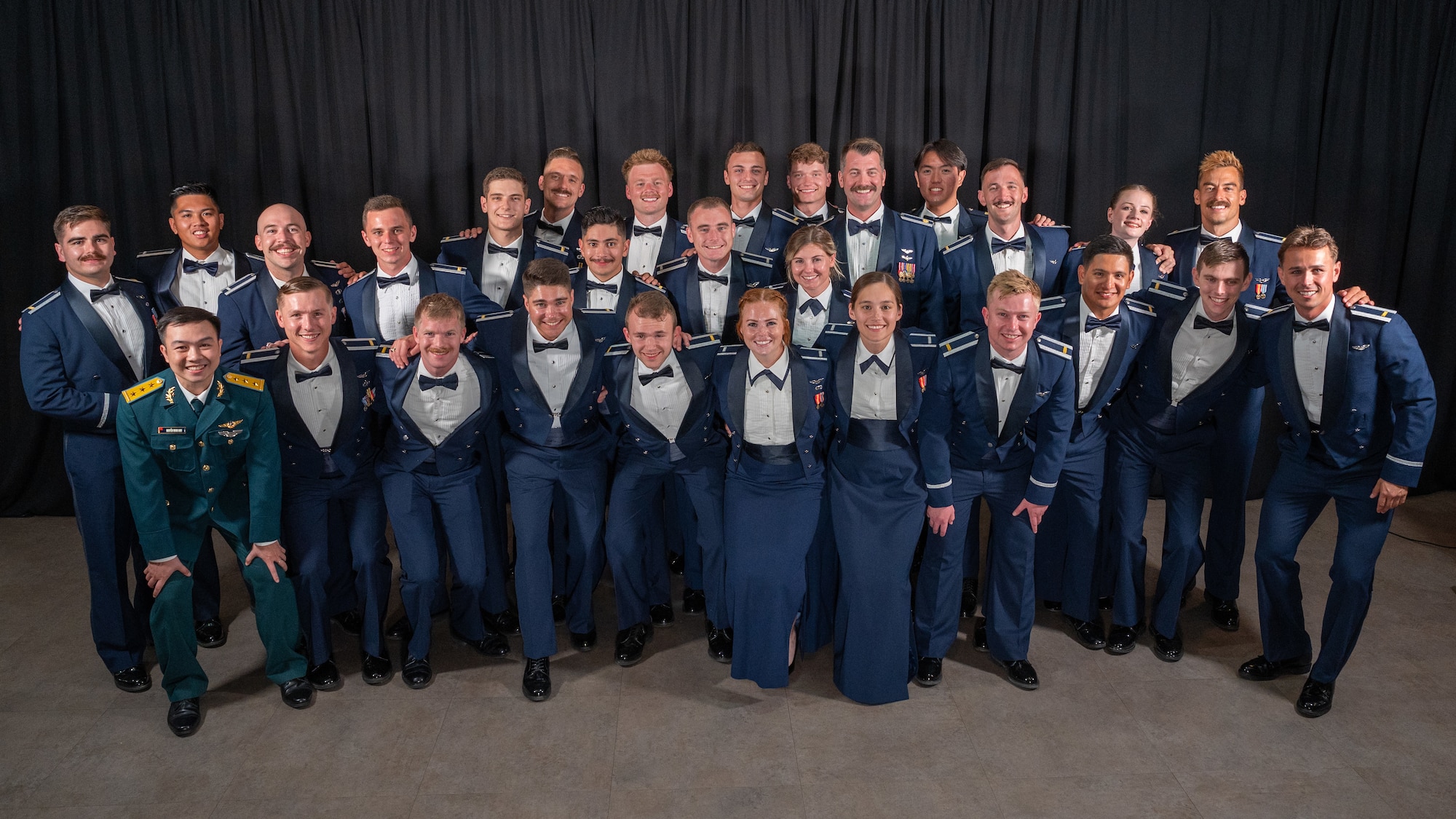 Class 25-13 poses for a group photo during graduation at Laughlin Air Force Base, Texas, Aug. 8, 2025. Class 25-13 consisted of 28 pilots from three different countries. (U.S. Air Force photo by Staff Sgt. Nicholas Larsen)