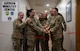 Members of Minot leadership and the Chapel Team cut a ribbon during the opening ceremony for the Airmen Ministry Center at Minot Air Force Base, North Dakota, Aug. 8, 2025. The Airmen Ministry Center is a space designed to foster connection, relaxation and camaraderie among Airmen of all ranks. (U.S. Air Force photo By Airman 1st Class Wesley Davies)