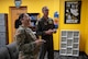 U.S. Air Force Col. Thomas Taylor, 5th Bomb Wing deputy commander, and Senior Airman Keolani Tran Copas, a religious affairs Airman, play a video game after the opening ceremony for the Airmen Ministry Center at Minot Air Force Base, North Dakota, Aug. 8, 2025. The Airmen Ministry Center was created to provide a welcoming environment where Airmen can unwind, connect and engage in activities they enjoy regardless of their position or rank. (U.S. Air Force photo by Airman 1st Class Wesley Davies)