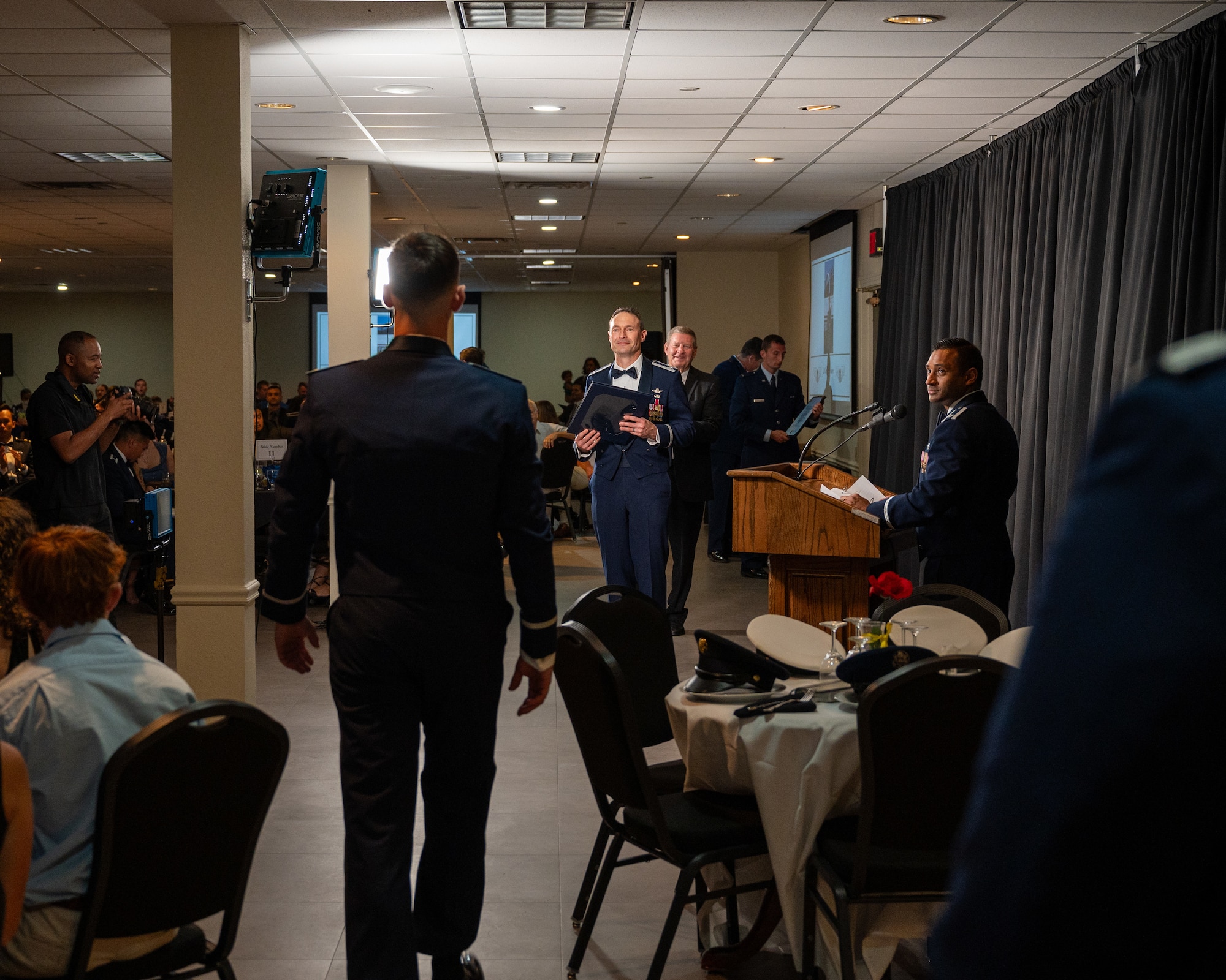 A U.S. Air Force Student pilot walks up to the graduation stage at Laughlin Air Force Base, Texas, Aug. 7, 2025. The pilot graduation ceremony marks the point where a student pilot is presented their wings and certificate of graduation. (U.S. Air Force photo by Staff Sgt. Nicholas Larsen)