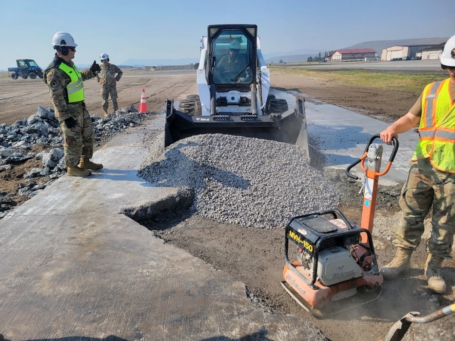 People fix a concrete pad