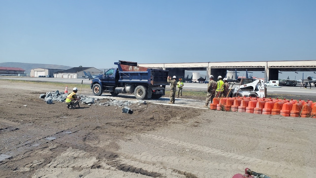 People fix a concrete pad