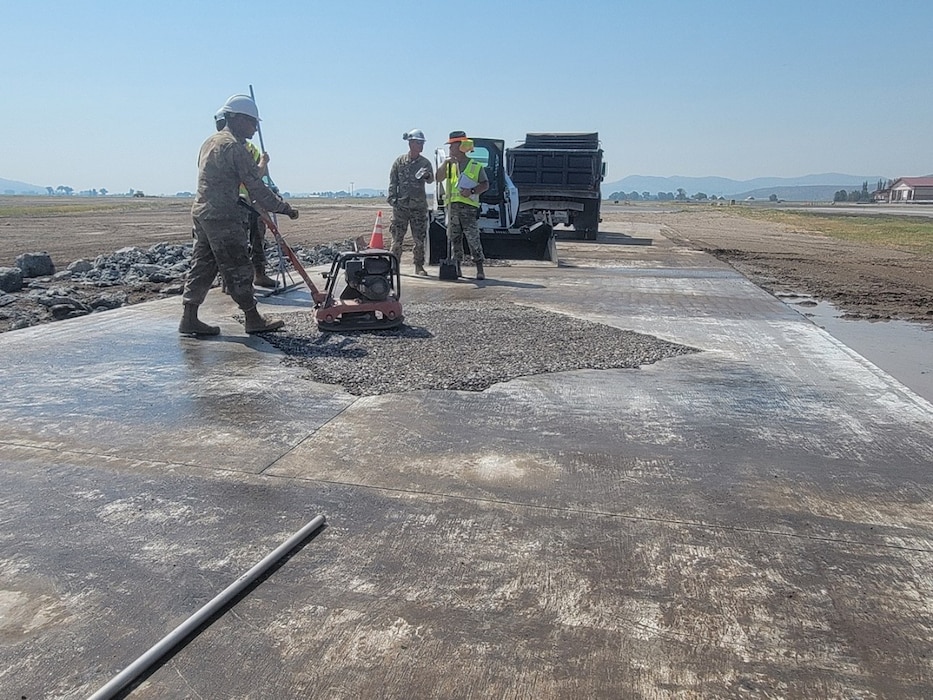 People fix a concrete pad