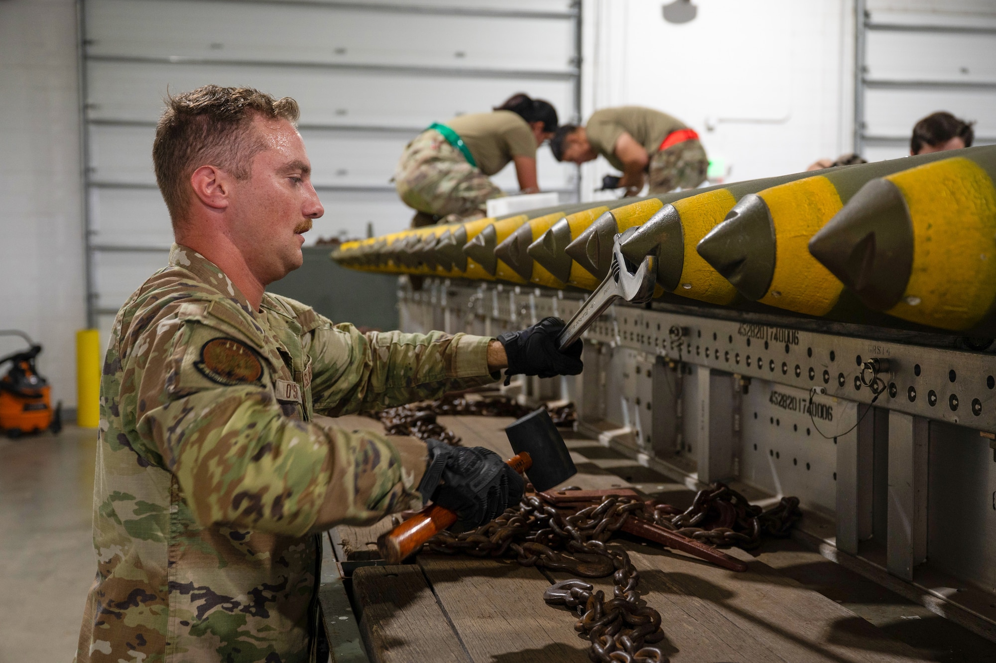 U.S. Air Force Airman 1st Class Zachary O’Shei, 5th Munitions Squadron (5MUNS) crew member, tightens the nose plug on a MK-82 conical munition at Minot Air Force Base, North Dakota, August 4, 2025. 5MUNS will compete in the Air Force Combat Operations Competition designed to test adaptability and technical sharpness