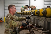U.S. Air Force Airman 1st Class Zachary O’Shei, 5th Munitions Squadron (5MUNS) crew member, tightens the nose plug on a MK-82 conical munition at Minot Air Force Base, North Dakota, August 4, 2025. 5MUNS will compete in the Air Force Combat Operations Competition designed to test adaptability and technical sharpness