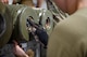 An Airmen assigned to the 5th Munitions Squadron (5MUNS) tightens the fuses on the back of a MK-82 conical munition at Minot Air Force Base, North Dakota, August, 4, 2025. 5MUNS will compete in the Air Force Combat Operations Competition designed to test adaptability and technical sharpness.