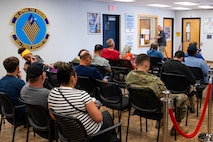 People waiting in a waiting room.