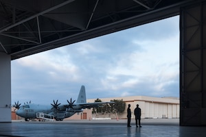 U.S. Air Force Airmen speak at a hangar during Exercise Zia Sunbird at Naval Base Ventura County Point Mugu, California.