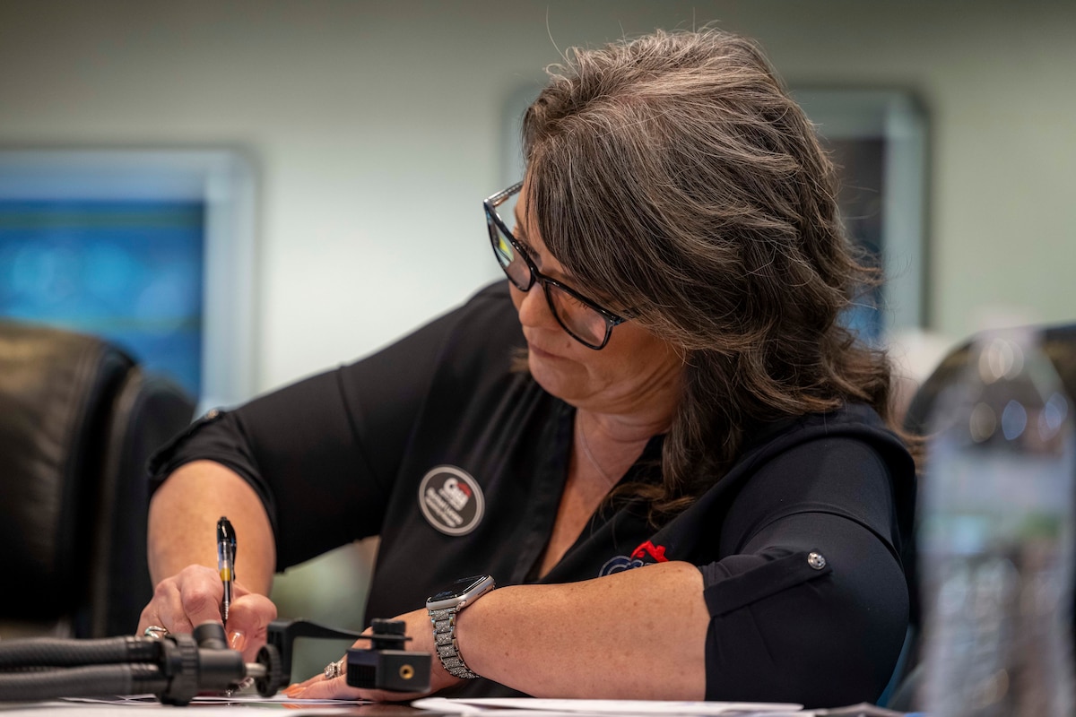 Rachel Lucero, Casa Auto Group marketing manager, writes down notes during the judging panel of the 2025 Big Give projects at Holloman Air Force Base, New Mexico, July 31, 2025.