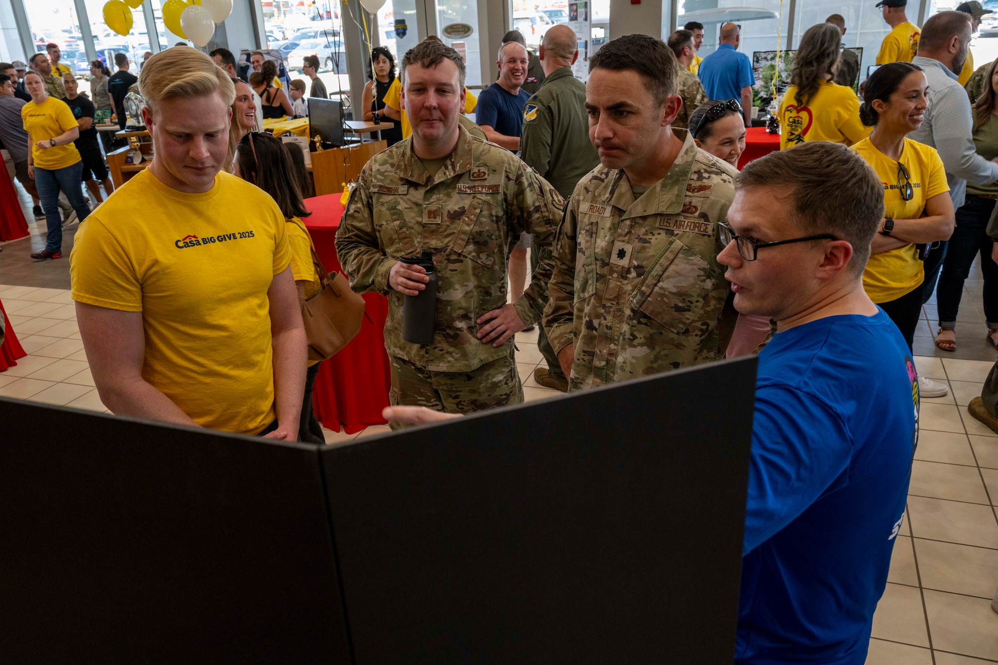 16th Training Squadron members share their presentations to Team Holloman members during the closing ceremony of the 2025 Casa Big Give at Alamogordo, New Mexico, Aug. 5, 2025.