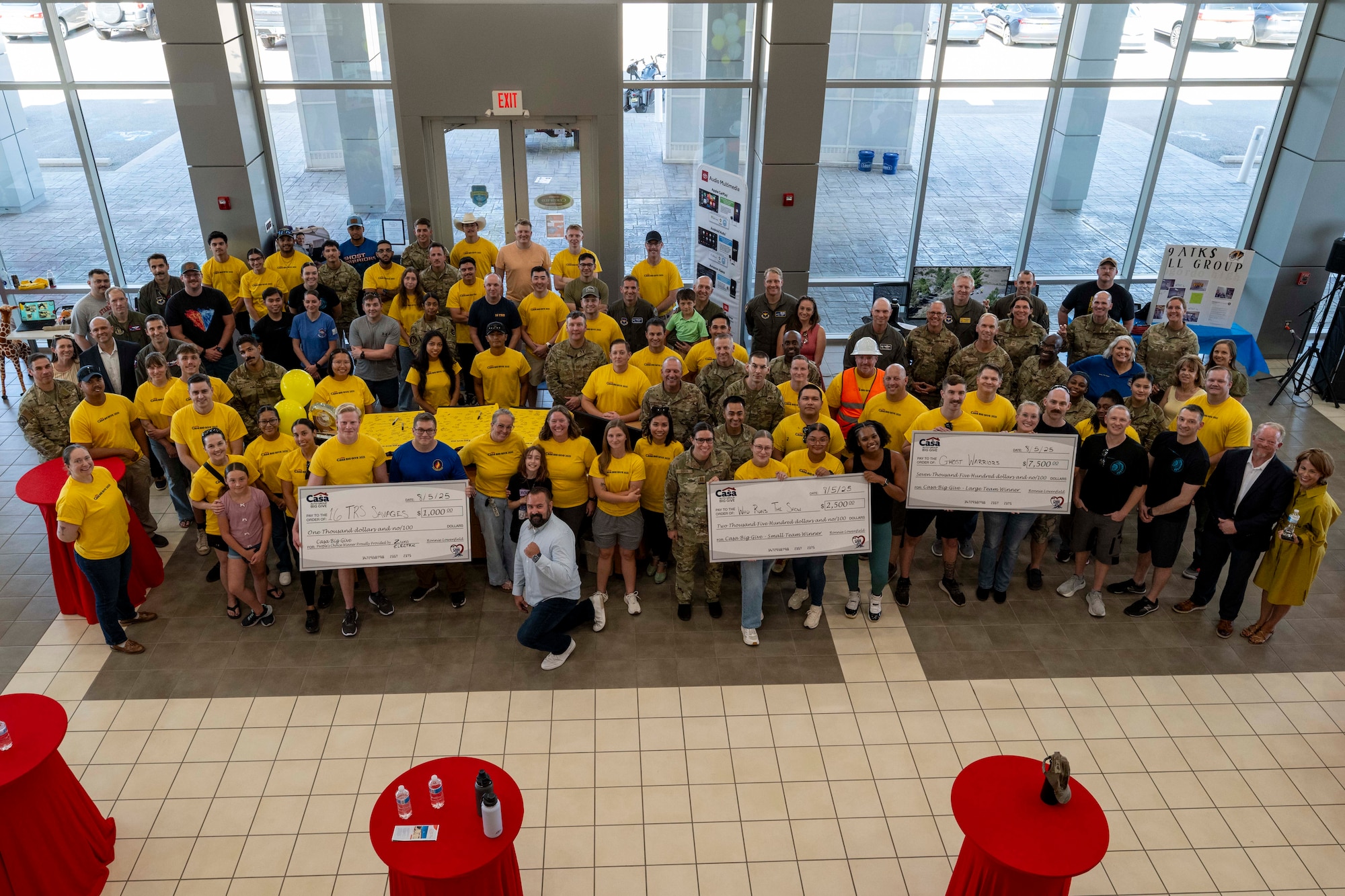 Team Holloman and community members pose for a photo during the closing ceremony of the 2025 Casa Big Give at Alamogordo, New Mexico, Aug. 5, 2025.