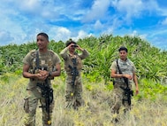 Service members doing simulated perimeter patrol.