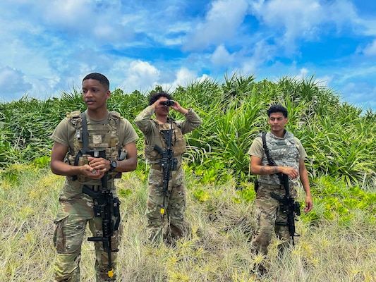 Service members doing simulated perimeter patrol.