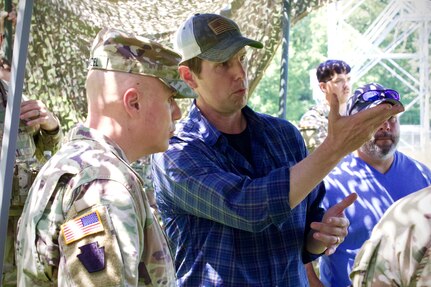 Jeff Mattson, a software engineer with Carnegie Mellon University’s Software Engineering Institute briefs Pennsylvania National Guard leaders during a demonstration at Fort Indiantown Gap, Pennsylvania, July 28, 2025. The Soldiers and representatives from Carnegie Mellon’s SEI demonstrated Project Shrike, an AI-enabled system for rapid target recognition and fire adjustment, by integrating drones and artillery during live-fire training. (U.S. Army National Guard photo by Maj. Travis Mueller)