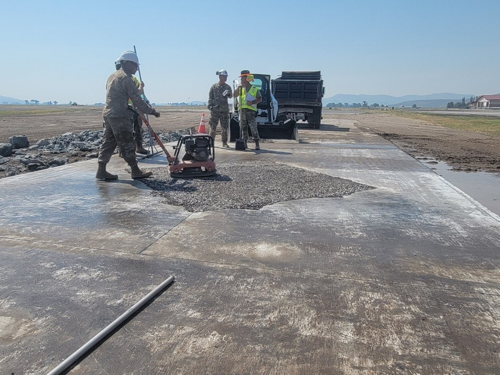 People fix a concrete pad