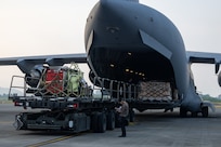 Cargo gets loaded onto a C-17 Globemaster III.