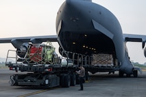 Cargo gets loaded onto a C-17 Globemaster III.