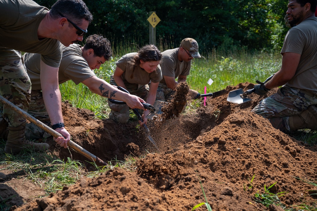 U.S. Air Force Airmen assigned to the 22nd Air Task Force, prepare a burial as part of a training during Exercise Northern Strike 25-2 at Battle Creek Air National Guard Base, Michigan, Aug. 8, 2025.