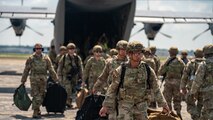 U.S. Airmen from various installations assigned to the 22nd Air Task Force disembark a C-130J Super Hercules assigned to the 815th Airlift Squadron, on the flight line during Exercise Northern Strike 25-2 (NS 25-2) at Battle Creek Air National Guard Base, Michigan, Aug. 8, 2025.