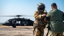 U.S. Soldiers assigned to the 2nd Battalion, 104th Aviation Regiment, receive simulated patients aboard a UH-60 Black Hawk helicopter during Exercise Northern Strike 25-2 (NS 25-2) at Battle Creek Air National Guard Base, Michigan, Aug. 8, 2025.