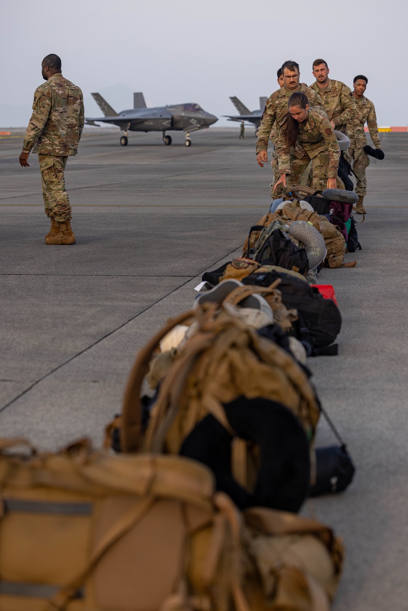 Airmen stage gear.