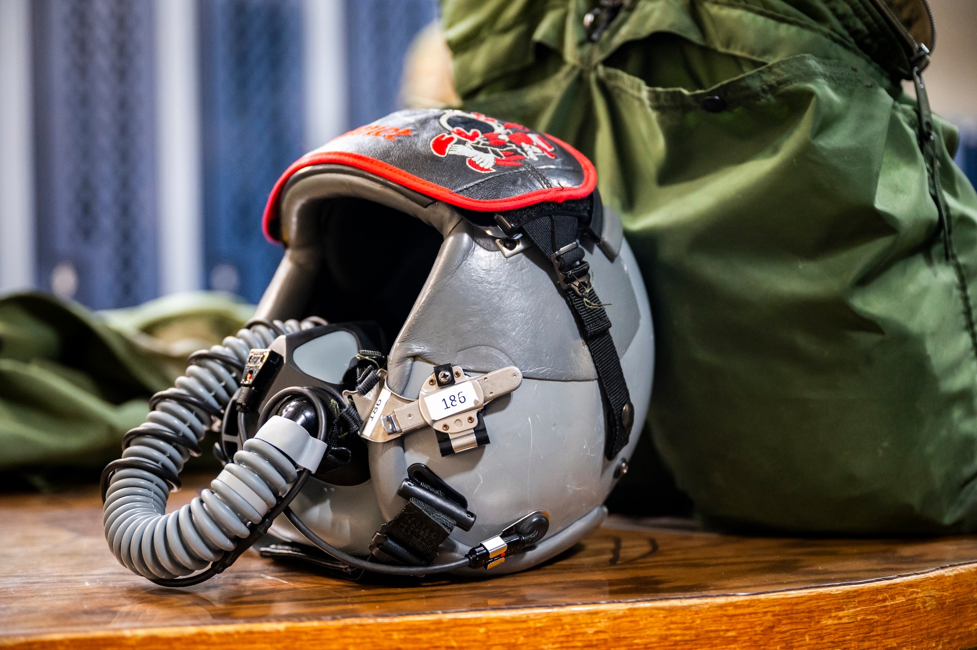 a pilot helmet sits on a table
