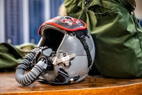 a pilot helmet sits on a table