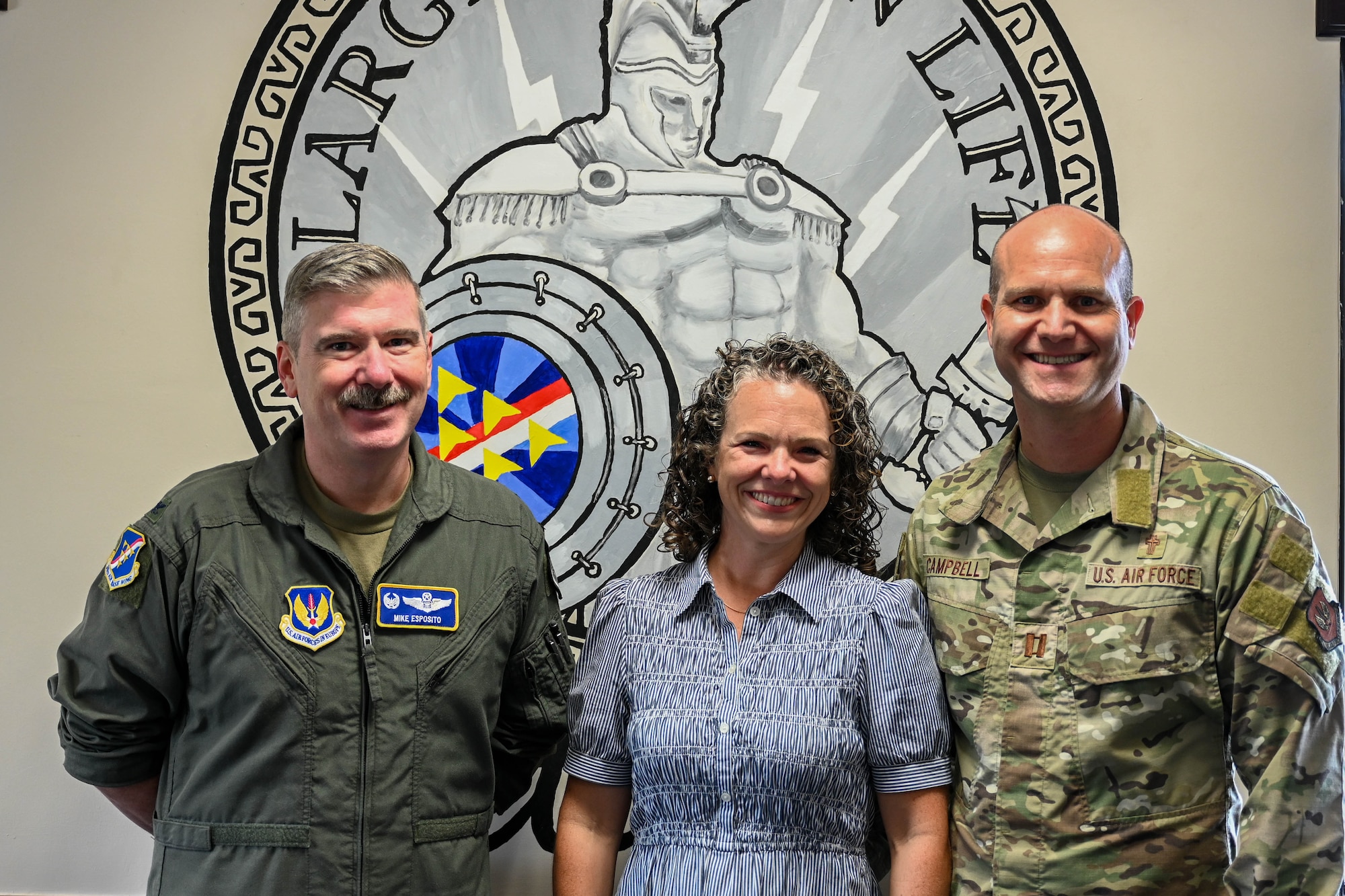 Military commander poses with military family for a photo