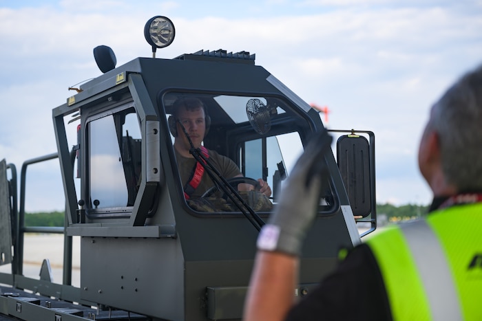 A U.S. Airman drives a loading truck