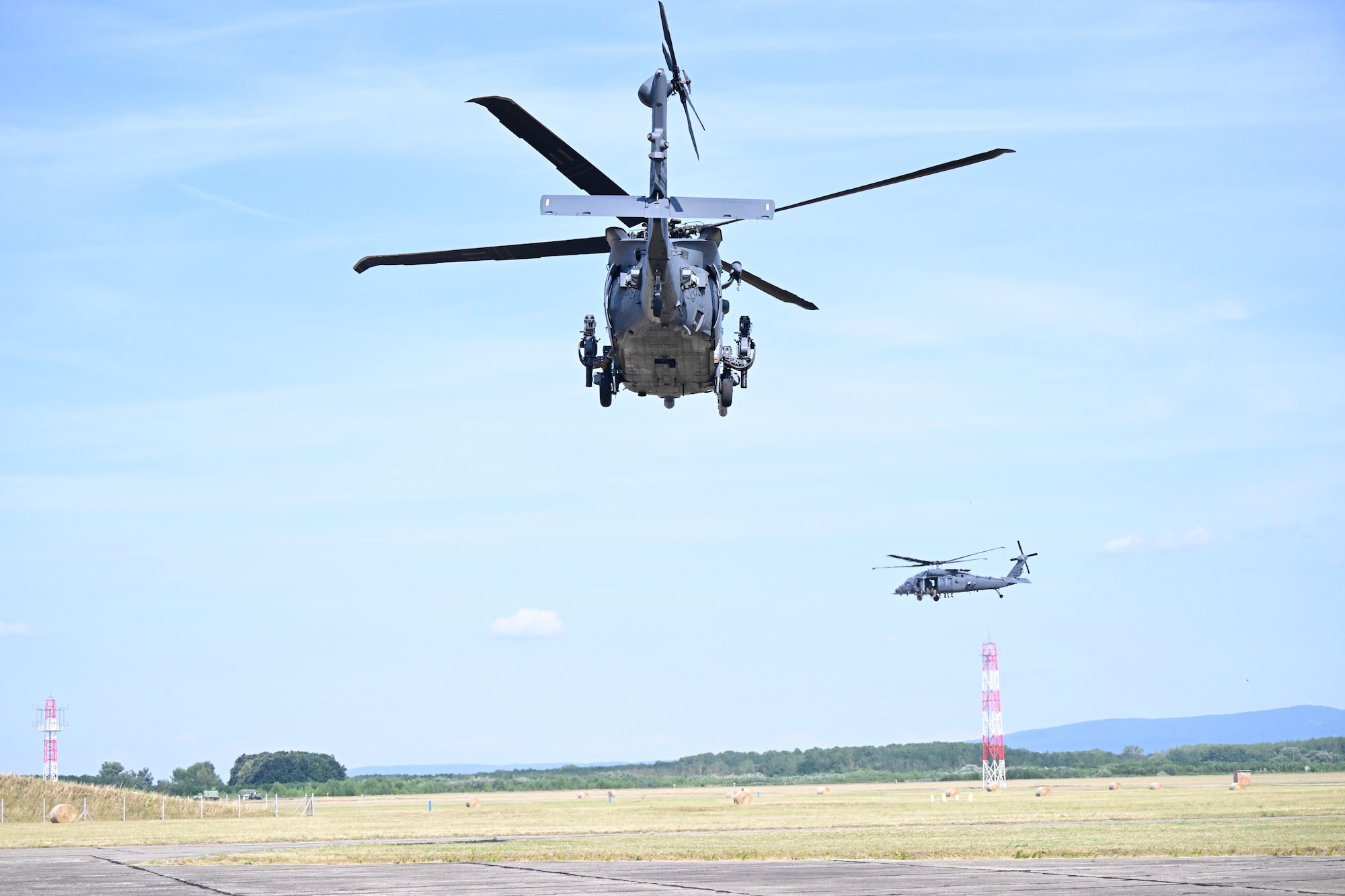 Two helicopters take off for flight.