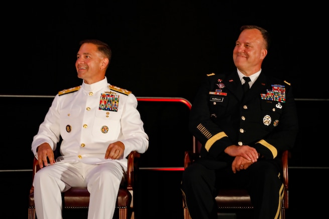 U.S. Central Command's (USCENTCOM) incoming commander, U.S. Navy Adm. Brad Cooper, left, and outgoing USCENTCOM outgoing commander, U.S. Army Gen. Michael Erik Kurilla, right, seated during a change of command ceremony, 8 August 2025. Multiple Department of Defense officials attended the event as well as distinguished defense leaders from partner nations around the world. (U.S. Central Command Public Affairs photo by Tom Gagnier)