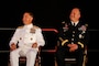 U.S. Central Command's (USCENTCOM) incoming commander, U.S. Navy Adm. Brad Cooper, left, and outgoing USCENTCOM outgoing commander, U.S. Army Gen. Michael Erik Kurilla, right, seated during a change of command ceremony, 8 August 2025. Multiple Department of Defense officials attended the event as well as distinguished defense leaders from partner nations around the world. (U.S. Central Command Public Affairs photo by Tom Gagnier)