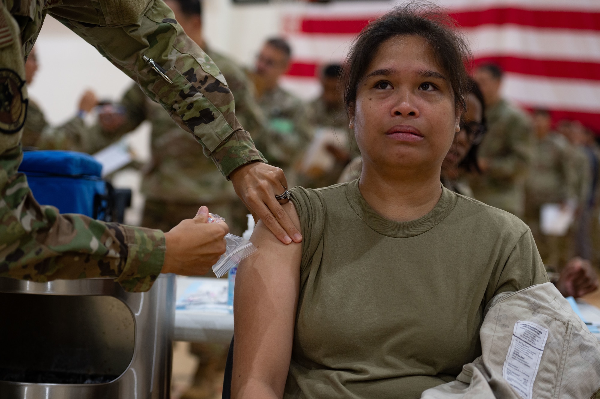 U.S. Air Force Senior Airman Danika Henderson, 87th Medical Group medical technician, receives a simulated vaccine during a Public Health Emergency exercise at Joint Base McGuire-Dix-Lakehurst, N.J., Aug. 7, 2025. During the exercise, mass amounts of patients simulated exposure to Anthrax and received medication or vaccines from medical staff.