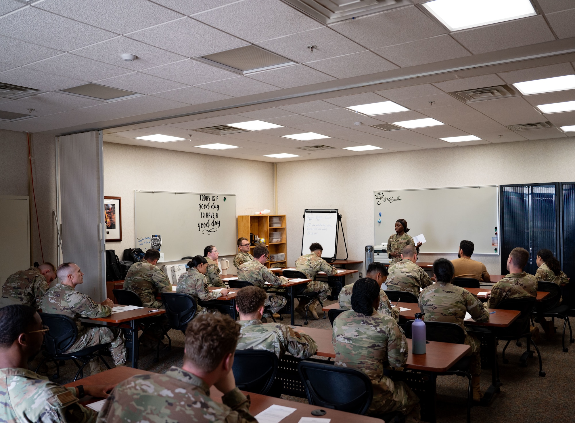 U.S. Air Force Airman 1st Class Lynnah Kakaire, 87th Medical Group public health technician, briefs Airmen simulating Anthrax exposure at Joint Base McGuire-Dix-Lakehurst, N.J., Aug. 7, 2025. The briefings informed Airmen of the next steps to take after exposure and allowed them to ask questions to medical technicians.