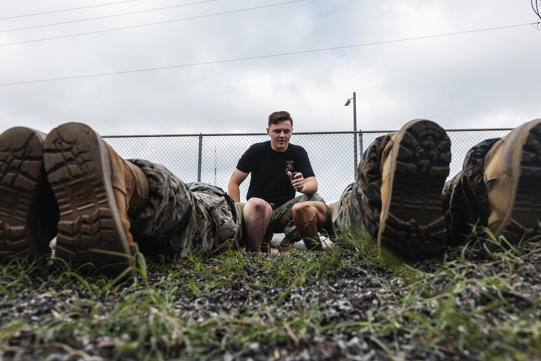 U.S. Marine Corps Sgt. Ethan Templeton, a ground electronics transmission systems maintainer with Electronics Maintenance Company, 2nd Maintenance Battalion, 2nd Marine Logistics Group, supervises combat conditioning on Marine Corps Base Camp Lejeune, North Carolina, Aug. 8, 2025. Templeton was nominated as the 2nd MLG Warrior of the Week for his exceptional leadership, technical expertise, and dedication to mentoring junior Marines through maintenance instruction, professional military education, and MCMAP training. Templeton is a native of Katy, Texas. (U.S. Marine Corps photo by Cpl. Meshaq Hylton)