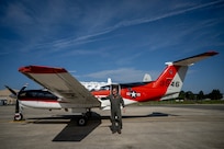 Lt. Cmdr. Patrick Heitman, Scientific Development Squadron (VXS) 1 project director, conducts preflight inspection on an RC-12M in Patuxent River, Md. May 2, 2025. VXS-1 conducts airborne scientific experimentation and advanced technology development in worldwide operations supporting U.S. Navy and national science and technology (S&T) priorities and war fighting goals.