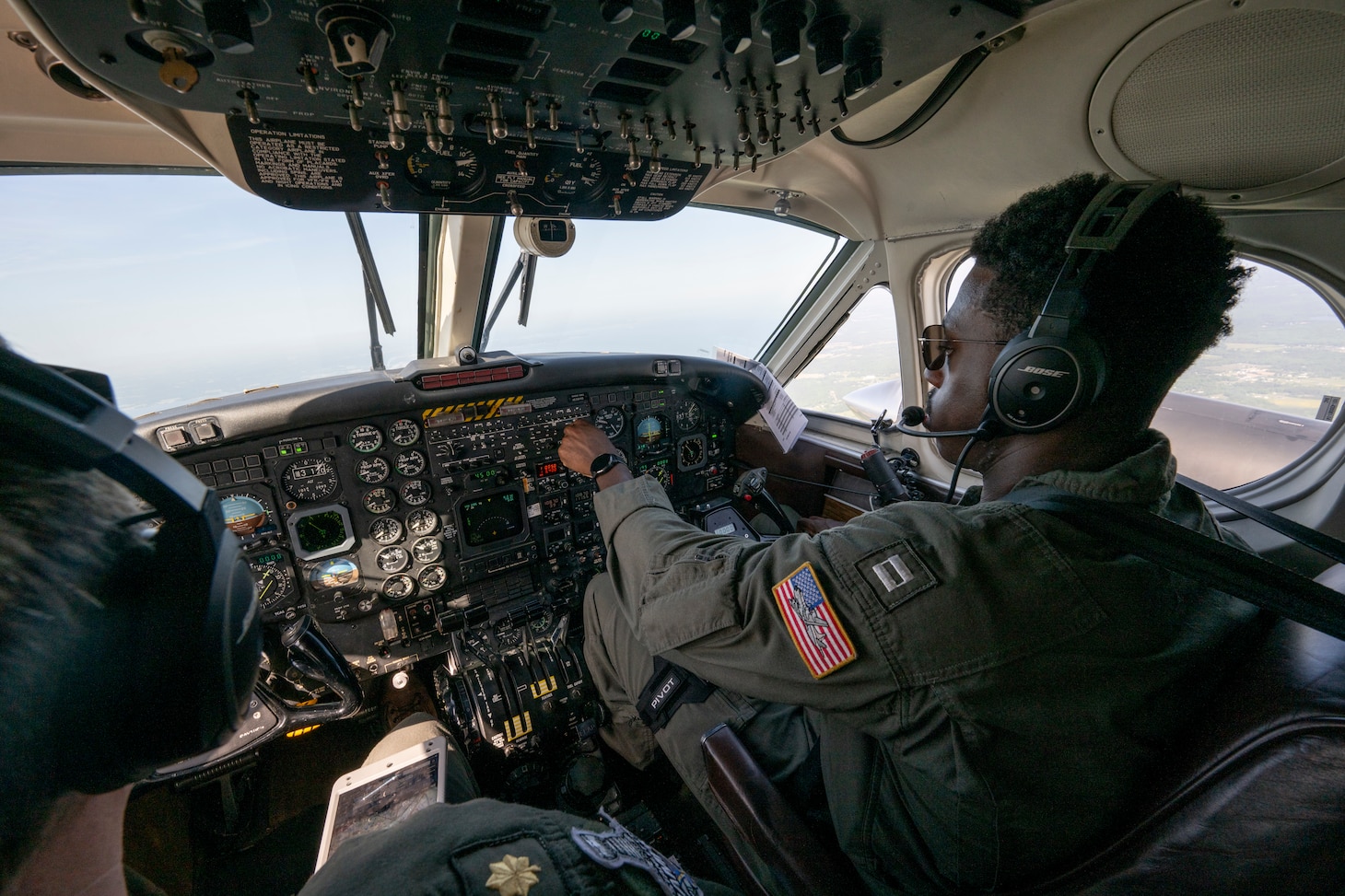 Lt. Avery Nwokike, Scientific Development Squadron (VXS) 1 pilot, flies an RC-12M in Patuxent River, Md. May 2, 2025.  VXS-1 conducts airborne scientific experimentation and advanced technology development in worldwide operations supporting U.S. Navy and national science and technology (S&T) priorities and war fighting goals.