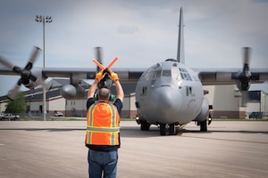 A U.S. Air Force C-130 Super Hercules from Youngstown Air Reserve Station, Ohio, is marshaled on the parking ramp at Grissom Air Reserve Base, Ind., Aug. 2, 2025. The aircraft transported personnel supporting Exercise Patriot Medic 25, the Air Force Reserve’s premier annual medical readiness event. (U.S. Air Force photo/Benjamin Mota)
