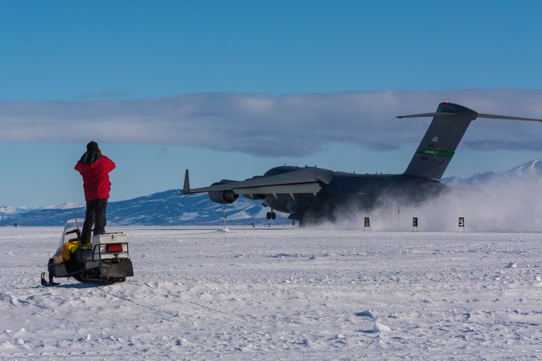 CRREL's George Blaisdell observes the final take-off of a C-17 Globemaster III after the successful first validation operations on the Phoenix compacted snow runway. Blaisdell’s work in the Antarctic and other extreme cold regions recently earned him admittance to The Explorers Club.