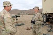 First Sgt. Nathan Brogan, left, Golf Company, 181st Brigade Support Battalion, Ephrata, Washington, talks with Sgt. 1st Class Jake Brand, right, 88 K, watercraft operator, and 92Y, Supply, Observer Coach/ Trainer, 1-364th Training Support Battalion, Joint Base Lewis McChord, during the Raven Focus exercise at Yakima Training Center, Washington, July 21, 2025.
